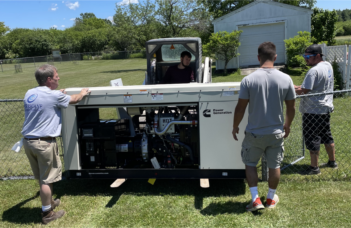 Hurricane Generators crew delivering a standby generator with a forklift